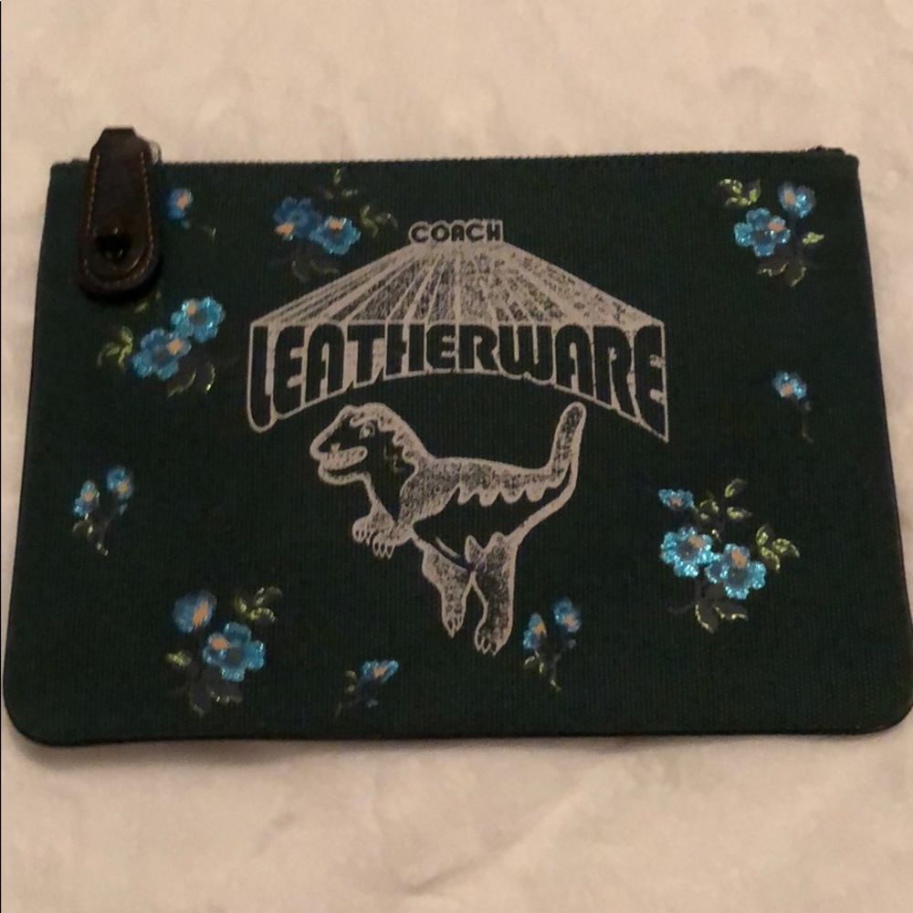 Brand new. Never used. Tags inside Coach pouch